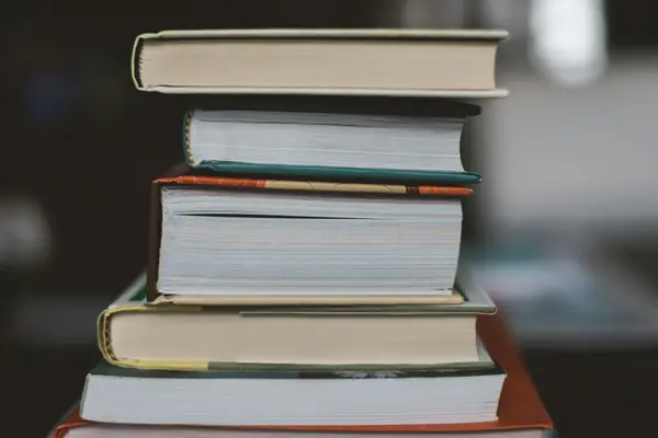 A stack of colourful books on a table