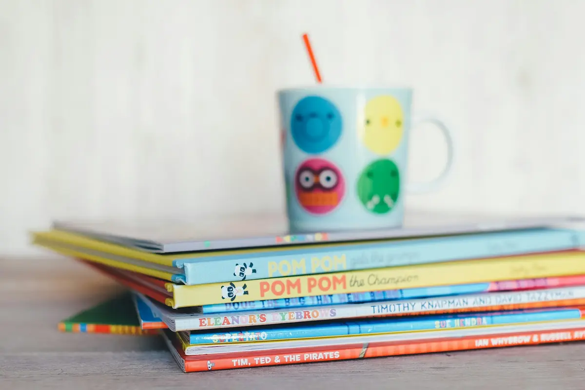 A colourful stack of storybooks illustrating vocabulary learning